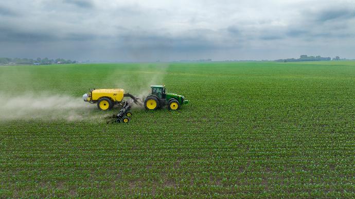 a few farm machines in a field